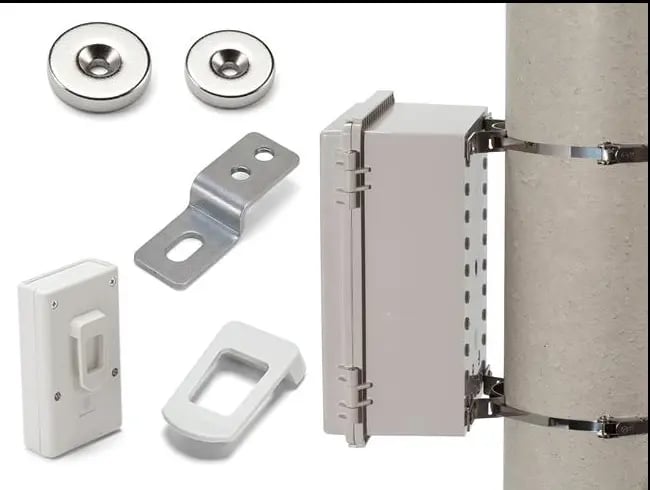 Weatherproof electrical enclosure kit with pole mounting brackets and magnetic mounting hardware.