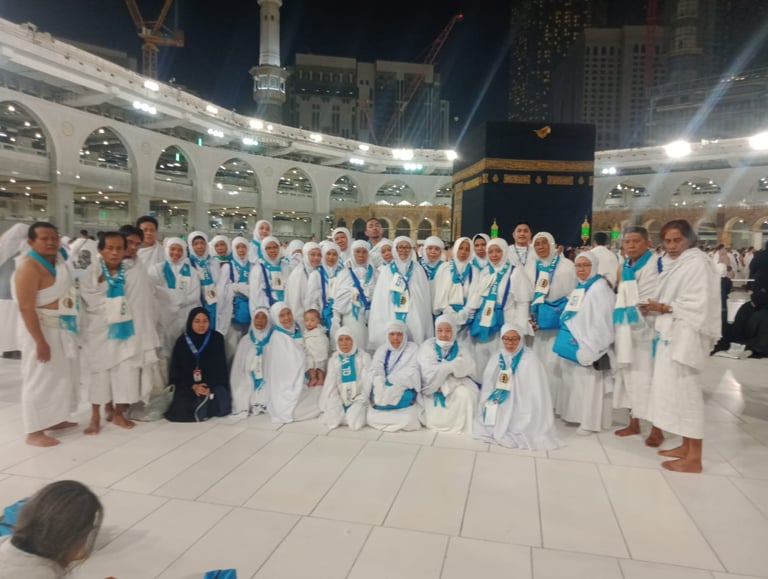 a group of people standing around a group of people in white robes