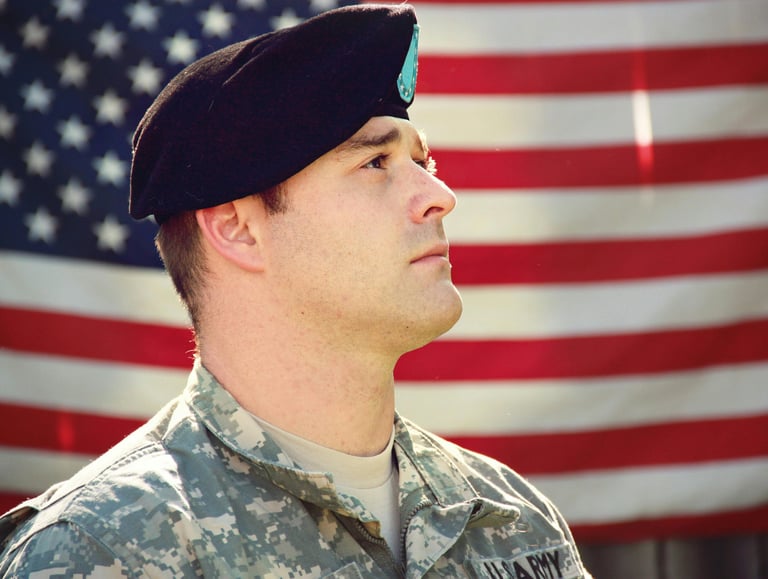 veteran looking eastward with the us flag as a backdrop