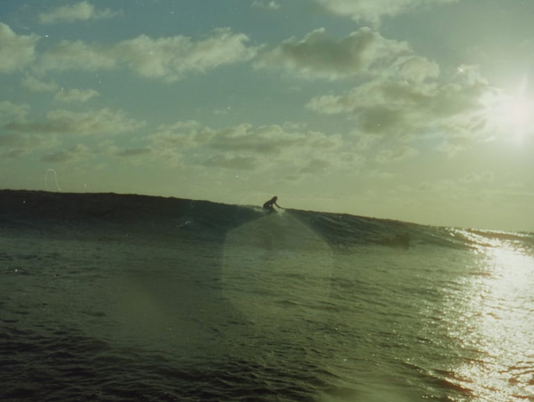 a surfer is riding a wave in the ocean