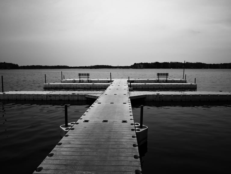 a dock with benches and benches in the water