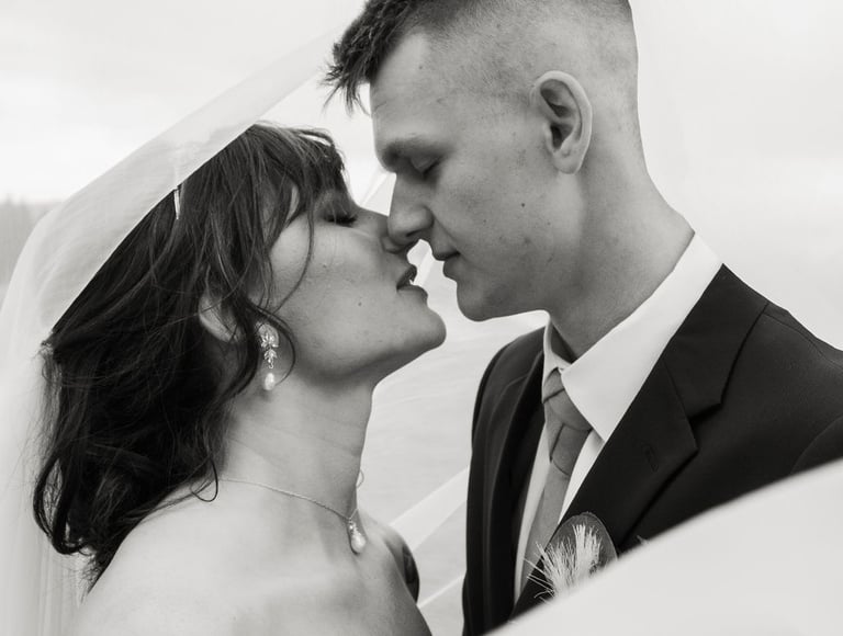 black and white bride and groom portrait, under the veil shot