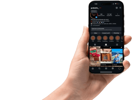 a person holding a cell phone in their hand