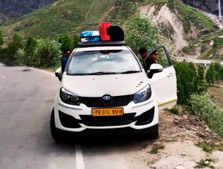 a car parked on a mountain side road