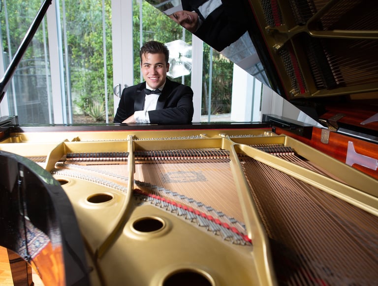 Daine Jordan at the piano before a classical piano performance