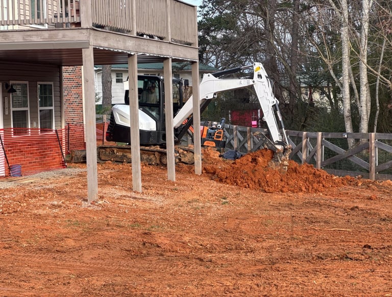 bobcat E60 excavator digging dirt for septic system in east tn