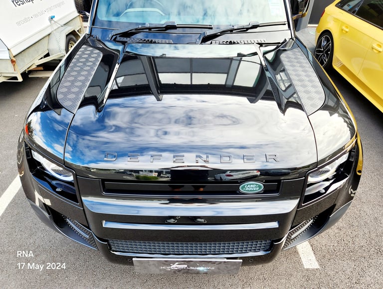 Front view of a black Land Rover Defender with ceramic coating applied by The Coating Lab Auckland