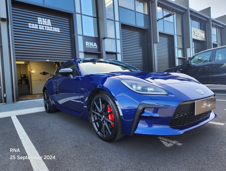 Ceramic coated blue Toyota GR86 sports car parked outside The Coating Lab Auckland