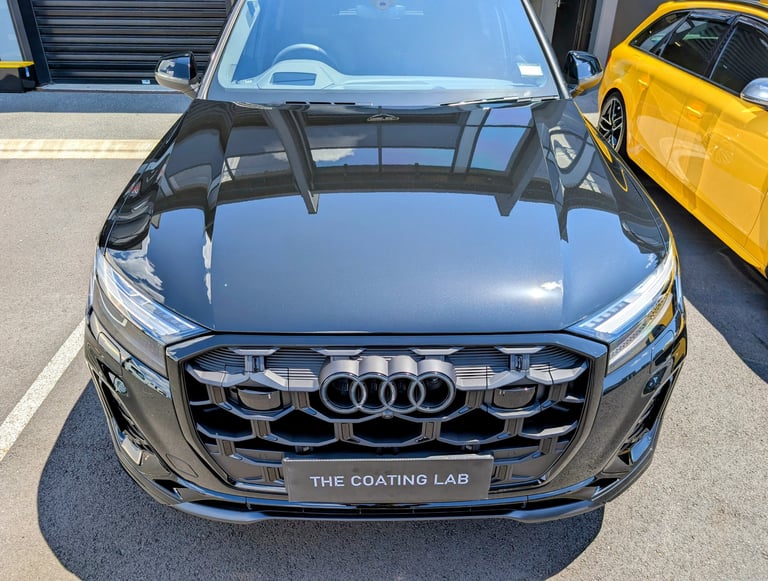 Front view of a black Audi SUV with a high-gloss ceramic coating finish from The Coating Lab.