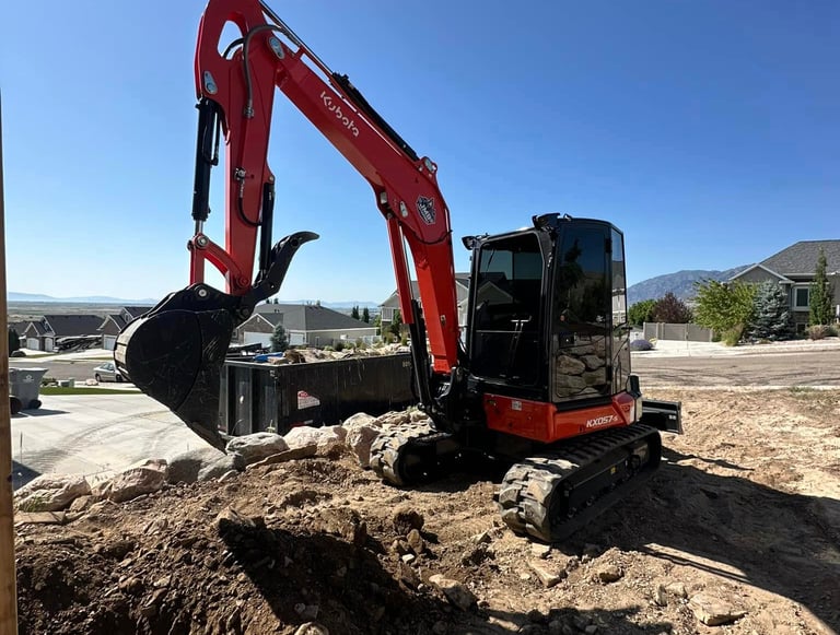 Kubota mini excavator digging dirt 
