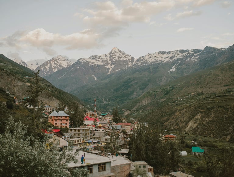 a mountain view of a town with a mountain in the background