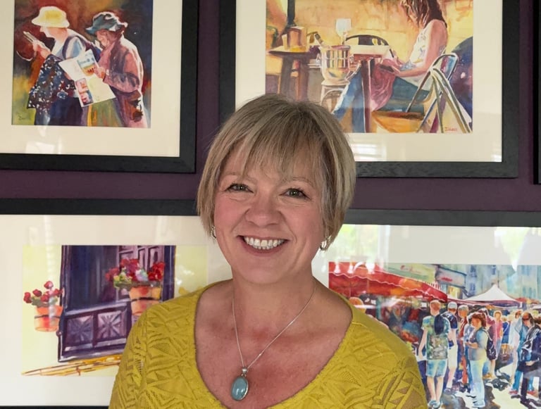 Deborah Lees infront of her paintings