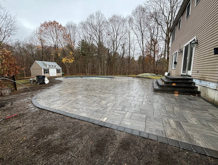 outdoor patio surrounding pool area in North Shore MA