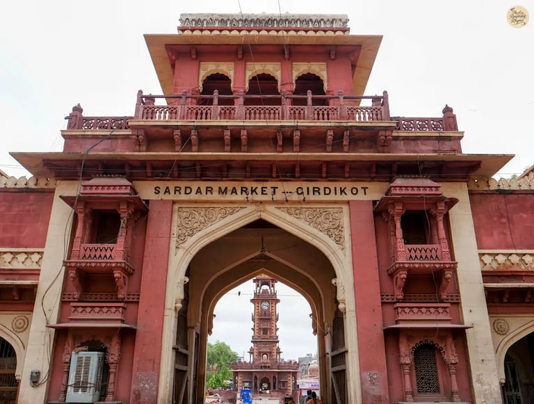 Entry gate of Sardar Market Jodhpur with iconic Clock Tower visible through the arch, showcasing heritage and local life.