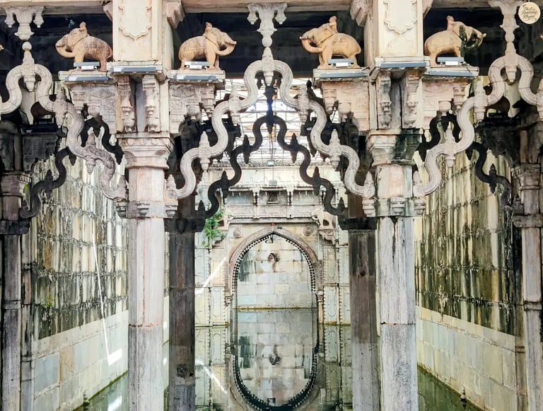 Ornate arches reflecting in the still waters of Rani Ji Ki Baori, Bundi — a mesmerizing play of stone and silence.