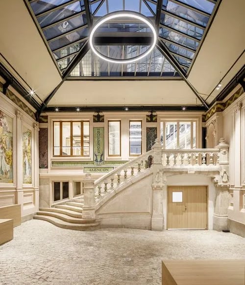 a large room with a staircase leading to a staircase