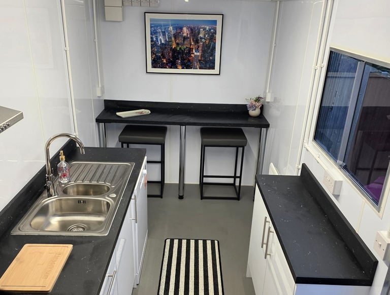Interior of a fully equipped temporary kitchen pod provided during insurance claims and home renovation projects.