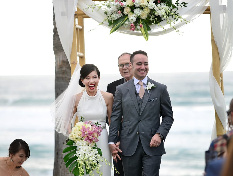 excited newlywed couple wedding at Scripps Seaside Forum