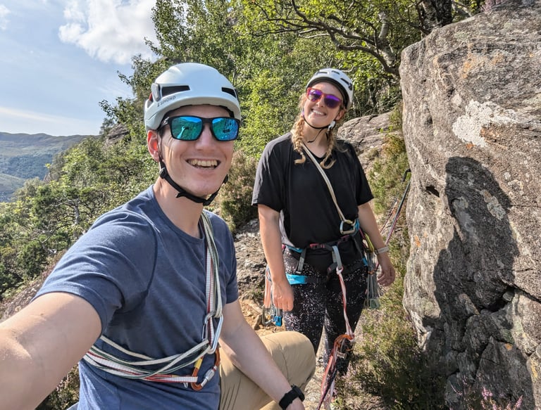 couple rock climbing