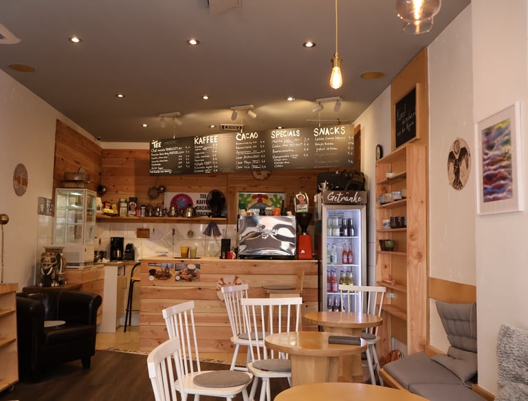 a cafe with a small table and chairs