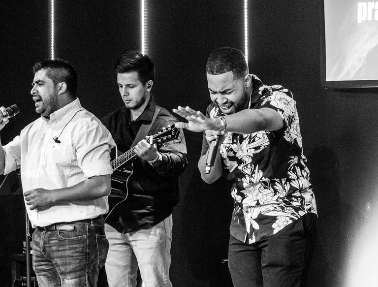 a group of men singing and playing instruments