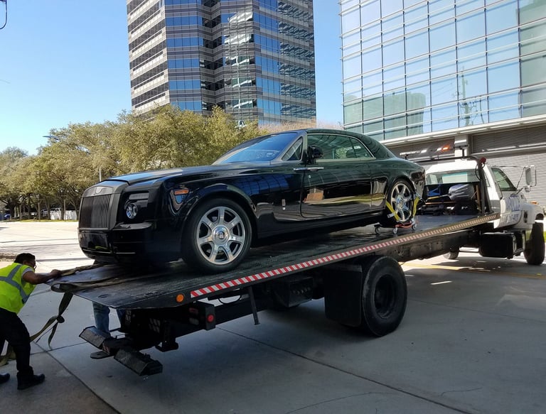 24/7 Towing of Rolls Royce by Cargo Collision Center Houston texas