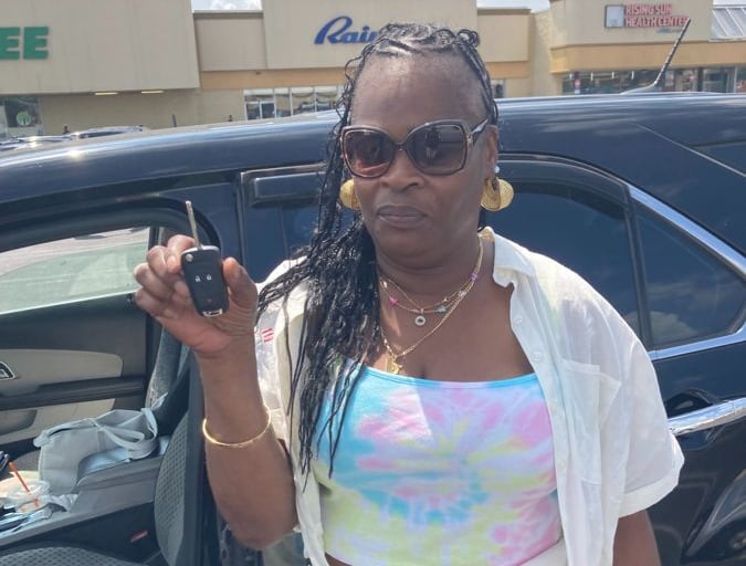 #Happy customer holding new spare remote key for 2011 Chevy Equinox in West Oak Lane, Philadelphia
