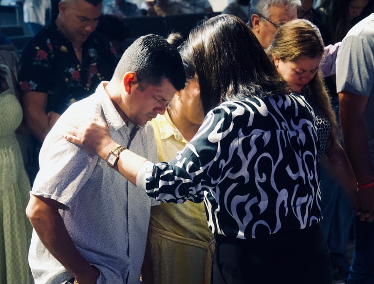 two people praying together