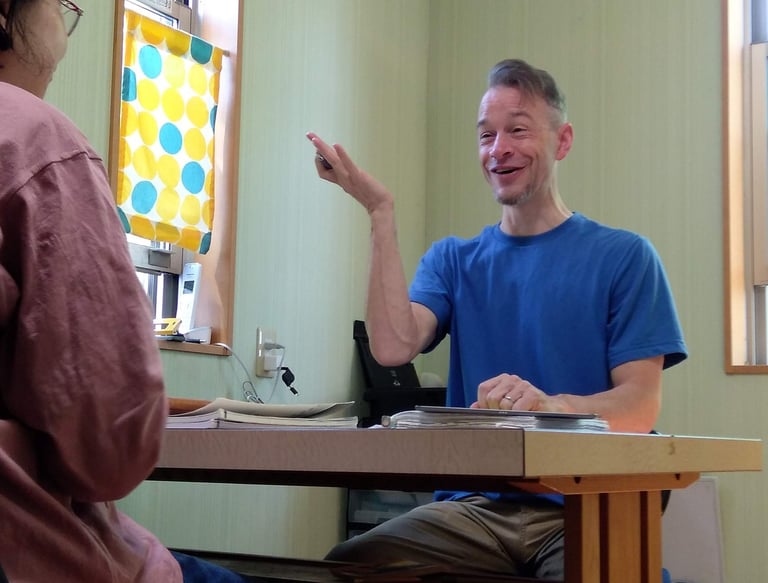 a man and woman sitting at a table