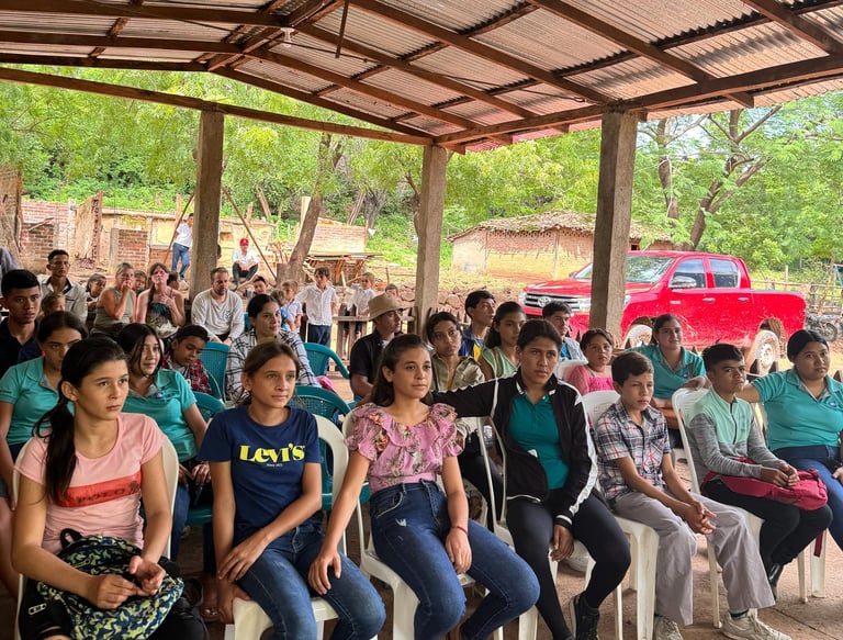 Students in Nicaragua sit together to hear testimonials.