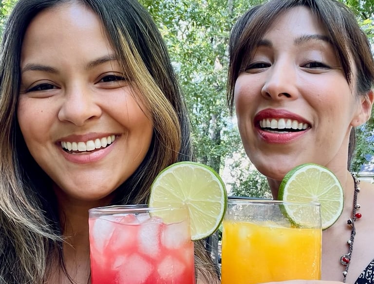 two women holding agua Frescas in orange county