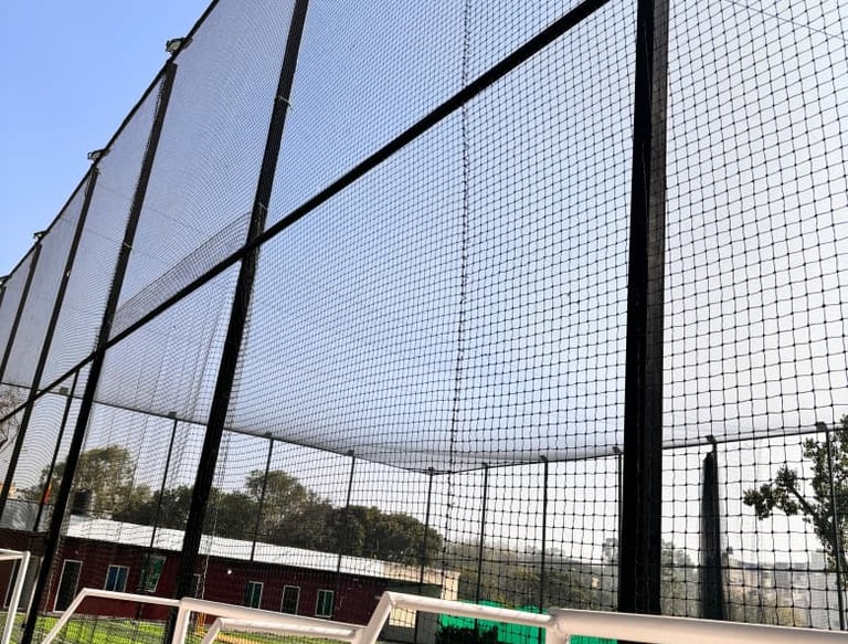 Close-up of a sturdy balcony safety net installed on a high-rise apartment in Chennai.