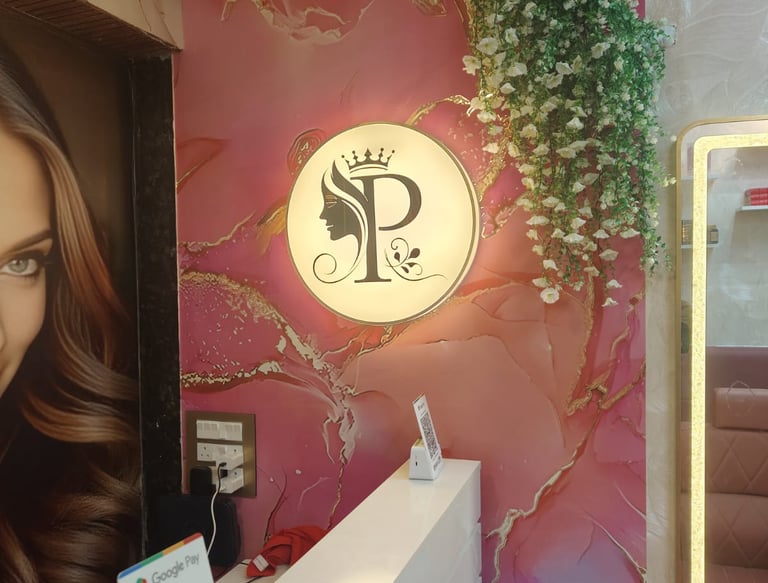 Reception area and salon logo at Pooja's Luxury Salon in Mira Road East