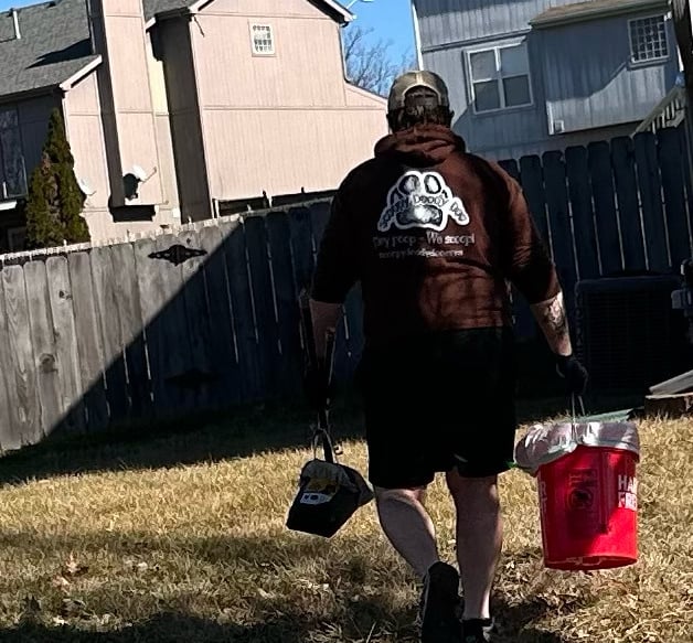 pet-waste-removal-employee-cleaning-clients-yard