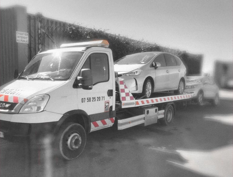 a tow truck with a flat bed and a flat bed