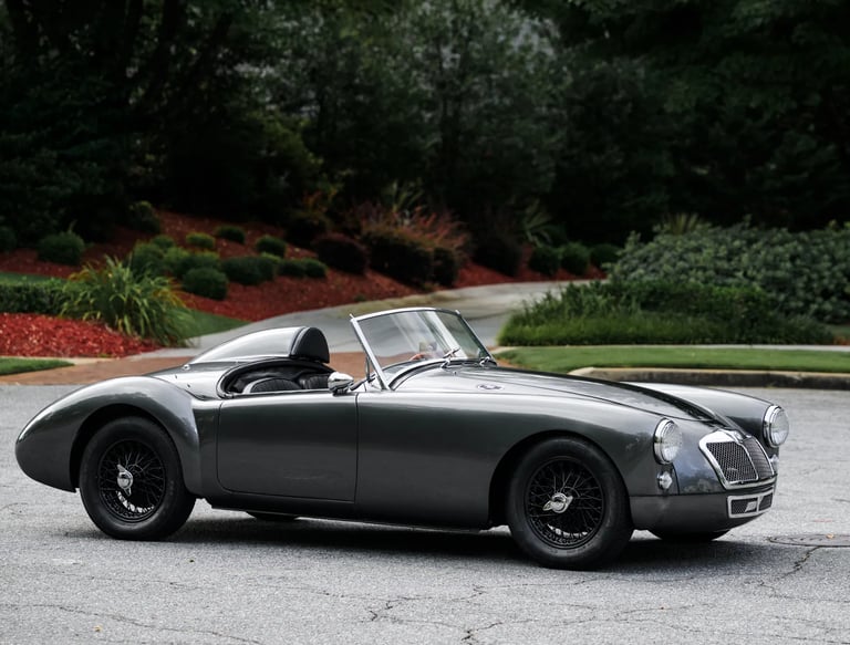 Side profile view of a dark grey 1958 MG MGA convertible 