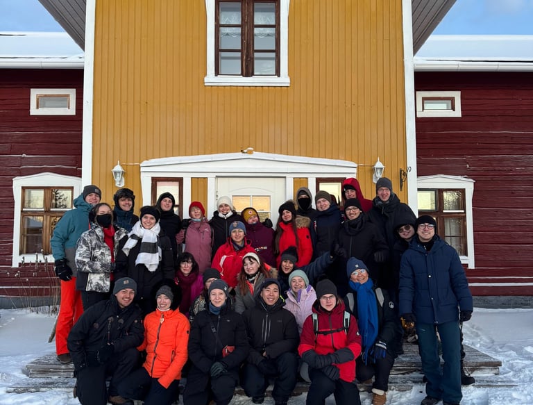 a group of people standing in front of a house