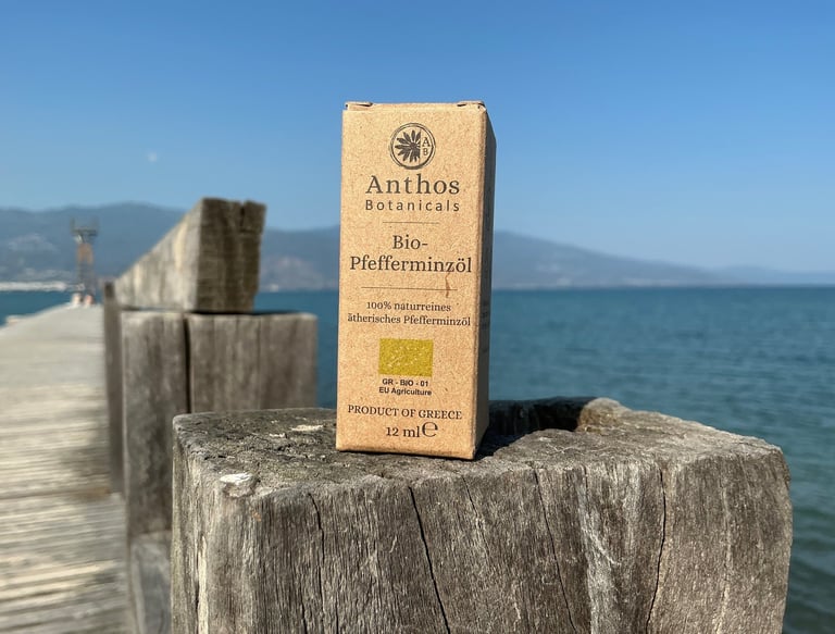 a box of peppermint essential oil on a wooden fence