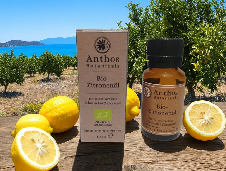a bottle of lemon essential oil and lemons on a table