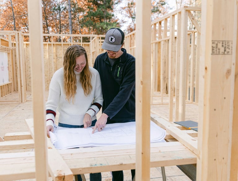 couple looking over construction plans