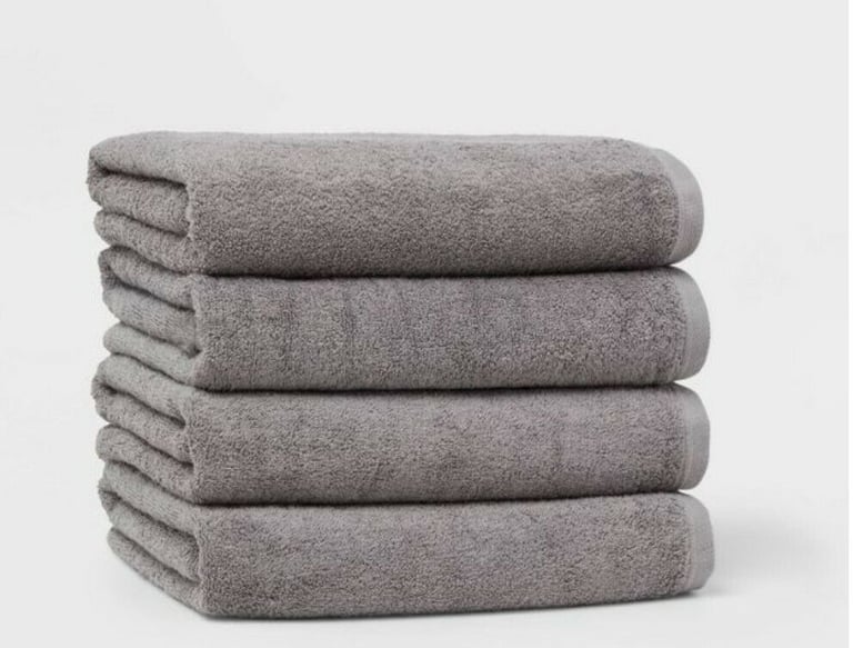 a stack of towels and towels on a white background
