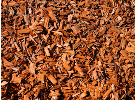 a pile of wood chips sitting on top of a pile of wood chips