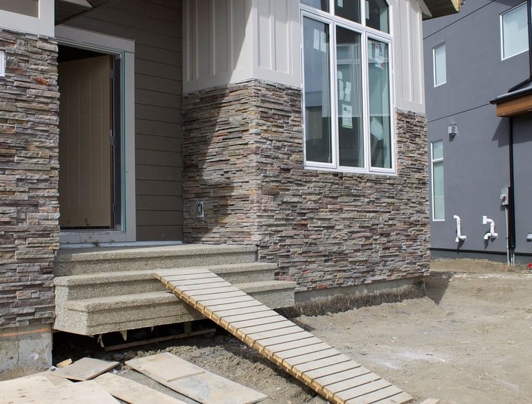 custom stone masonry installation on front of house