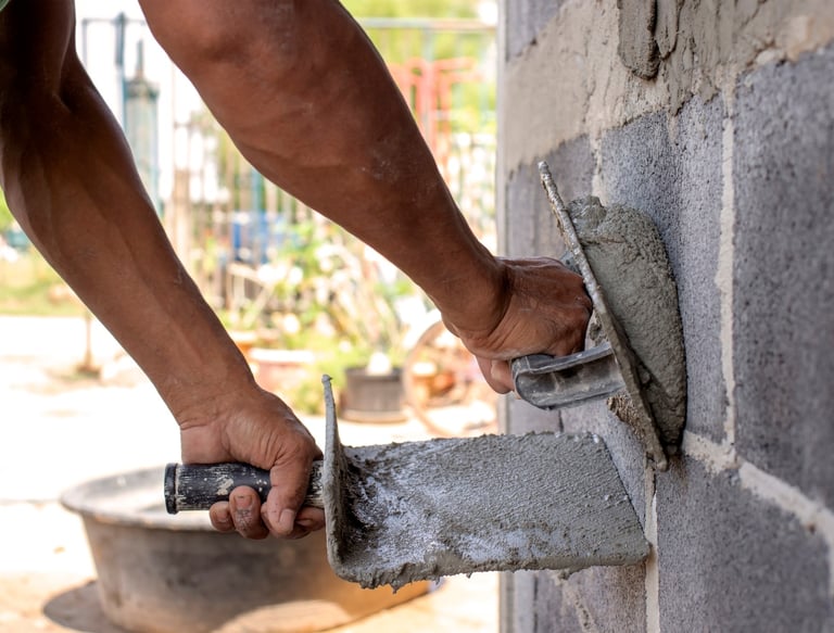 hawk and trowel used to spread concrete stucco and parging