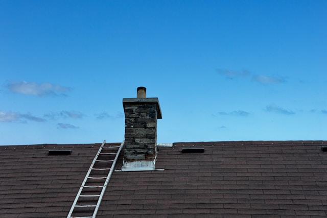 masons ladder to make chimney repairs
