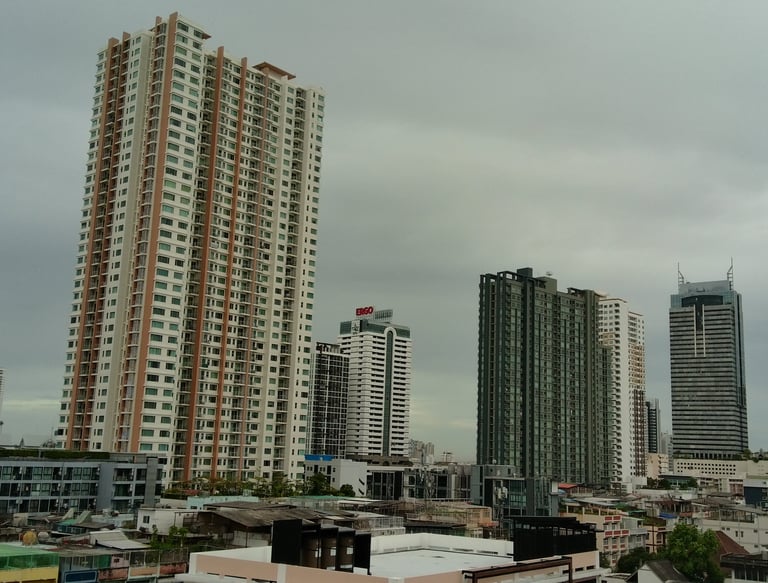 a city skyline with tall buildings and a clock tower