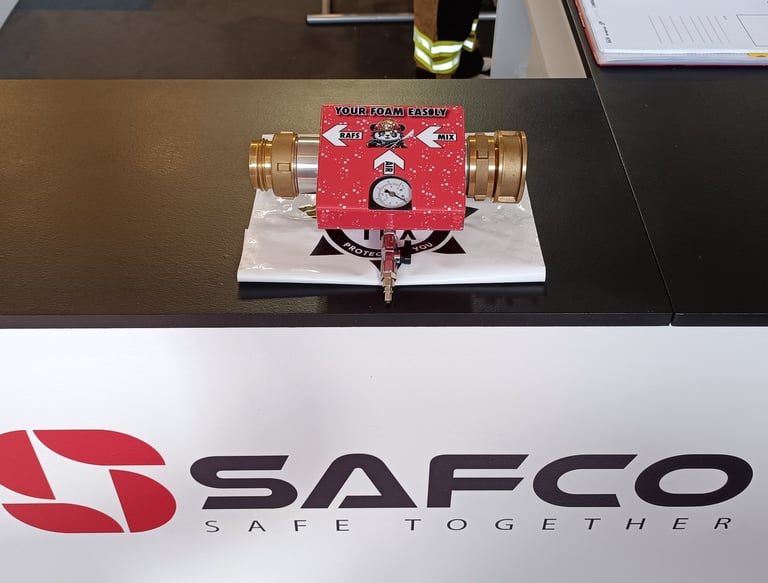 a table with a RAFS and a white sign that says safc