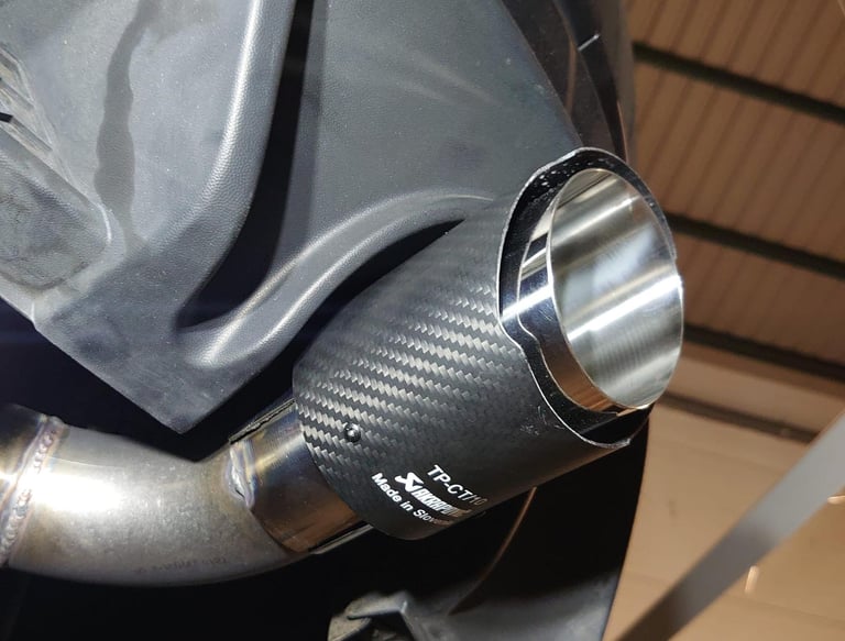 a close up of a car exhaust pipe pipe pipe pipe