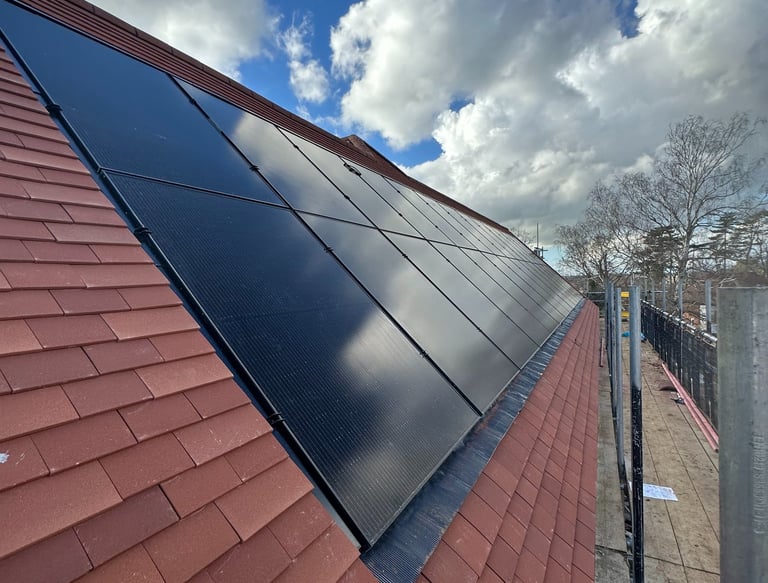 Towcester solar pv installation with Black solar panels installed in a red tile roof