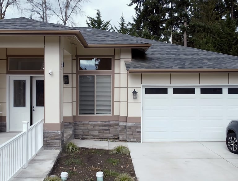 Adult family home with modern amenities including bedrooms, kitchen, accessible bathrooms, and cozy living areas.